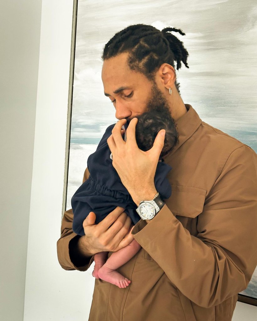 Single Image of Nigerian rapper Phyno and his newborn child