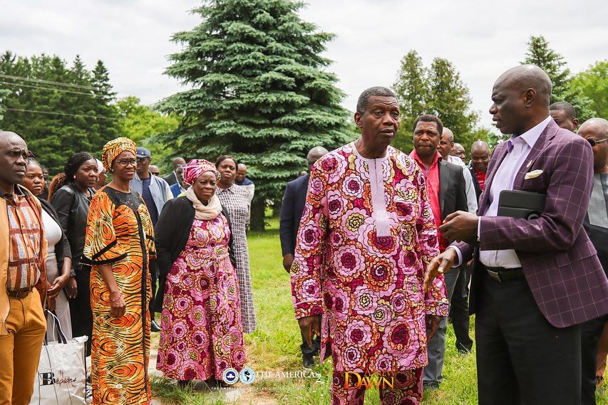 Pastor EA Adeboye inspecting land with wife and church staff.
