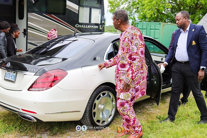 Pastor EA Adeboye stepped out of black and white colored Mercedes-Maybach; a church staff opened car door.