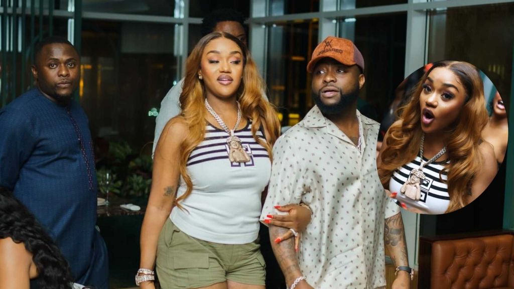 Talent manager Ubi Franklin walking into an event alongside Chioma who crossed hands with her superstar husband Davido 