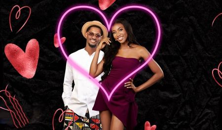 BBNaija stars Topher and Anita. Topher in a white long sleeve shirt and Anita in a purple dress, both within a pink heart outline against a black background adorned with smaller red hearts.