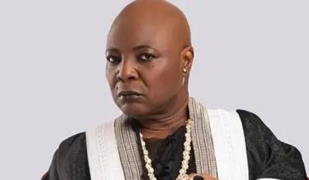 Veteran singer Charly Boy wearing a black outfit with white details and multiple necklaces.