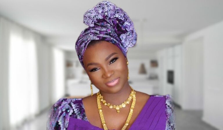 Therapist Jaruma is pictured wearing a vibrant, patterned dress with bold colors. She has a confident expression, with her hair styled in loose waves and accessorized with statement jewelry.