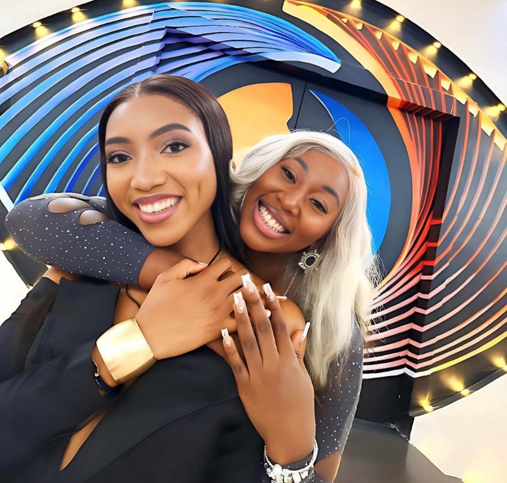BBNaija stars Anita (front) and Nelly (back) smiling and posing together.