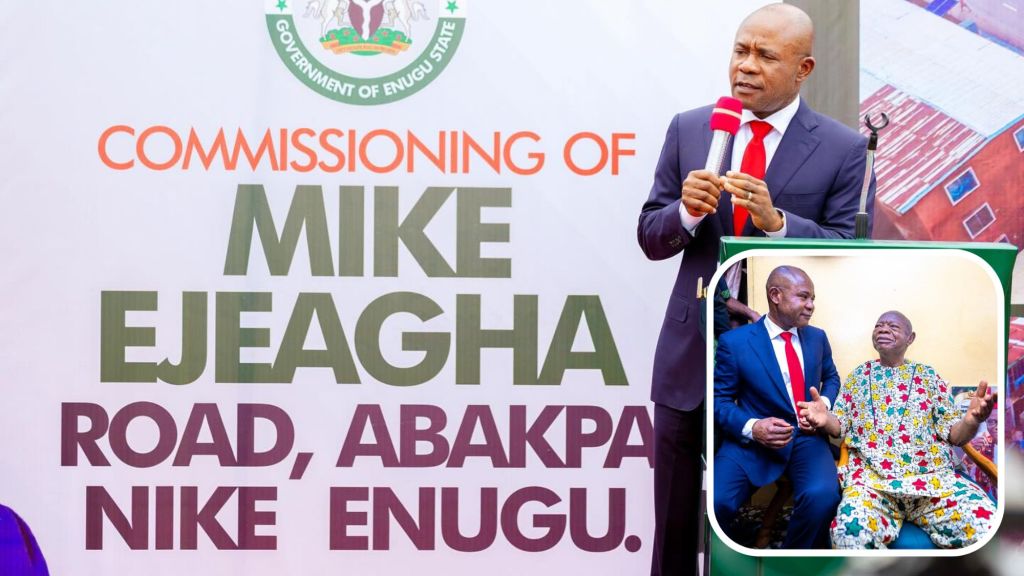 Governor Peter Mbah holding a mic and addressing the audience at the commissioning of Mike Ejeagha Road in Abakpa Enugu