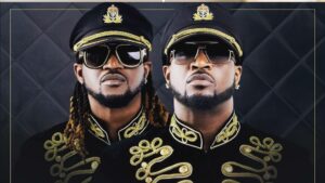 Psquare, the Nigerian music duo and twin brothers, in ornate black and gold military-style jackets. Faces pixelated for privacy.