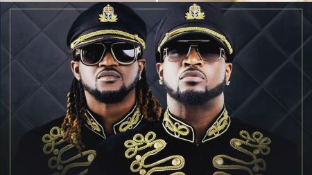 Psquare, the Nigerian music duo and twin brothers, in ornate black and gold military-style jackets. Faces pixelated for privacy.