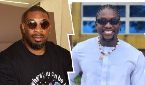 Portraits of Don Jazzy and Verydarkman: Don Jazzy is wearing sunglasses and a black T-shirt, while the Verydarkman is smiling in a traditional outfit adorned with a necklace. The background features a bright and colorful setting.