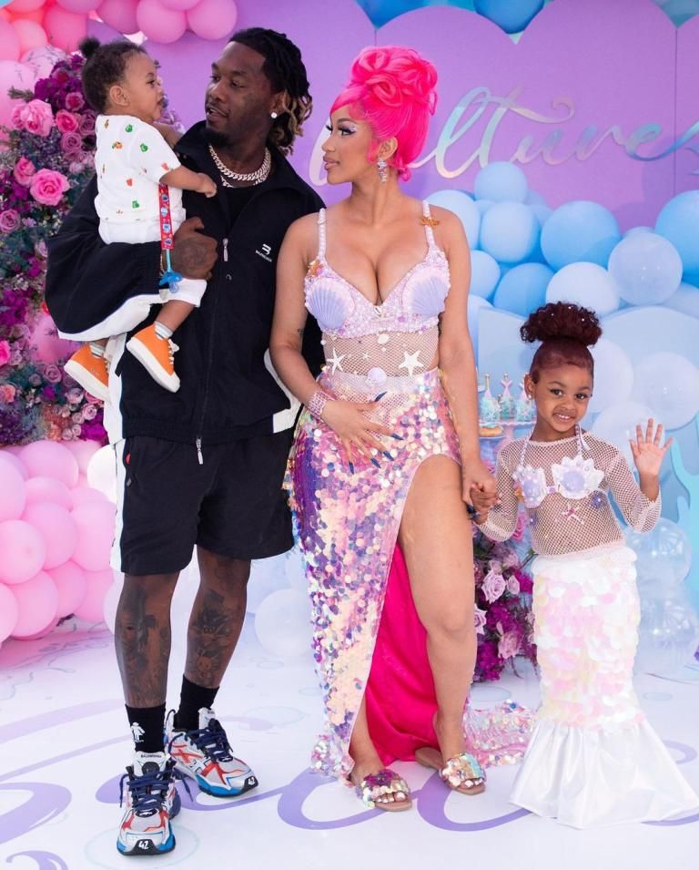 In a heartfelt moment, rapper Cardi B is seen celebrating with her ex-husband Offset and their children, Kulture and Wave, amidst colorful decorations.