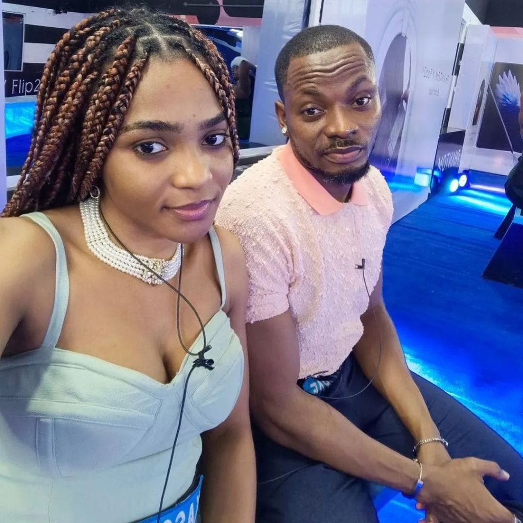 BBNaija stars and couple Kellyrae and Kassia, Kassia with braids and the Kellyrae in a light pink shirt, both sitting together.