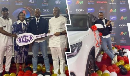 BBNaija season 9 winner Kellyrae celebrates as he receives the keys to his new car from event organizers. Surrounding him are key representatives, with the car adorned in festive ribbons and balloons, highlighting the joyous occasion.
