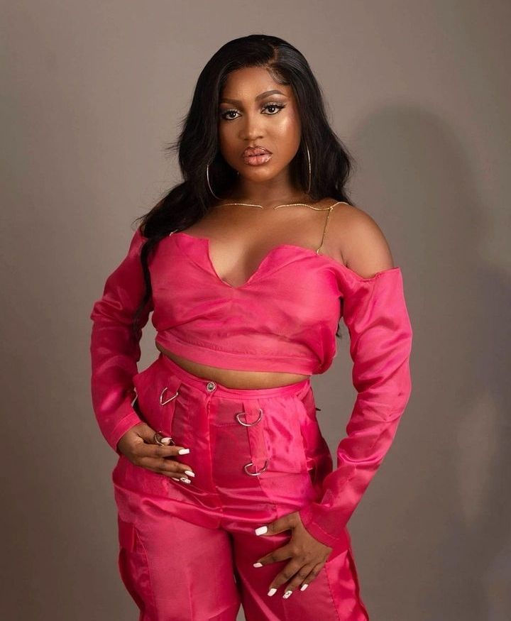 BBNaija star Wanni poses confidently in a stylish pink outfit.