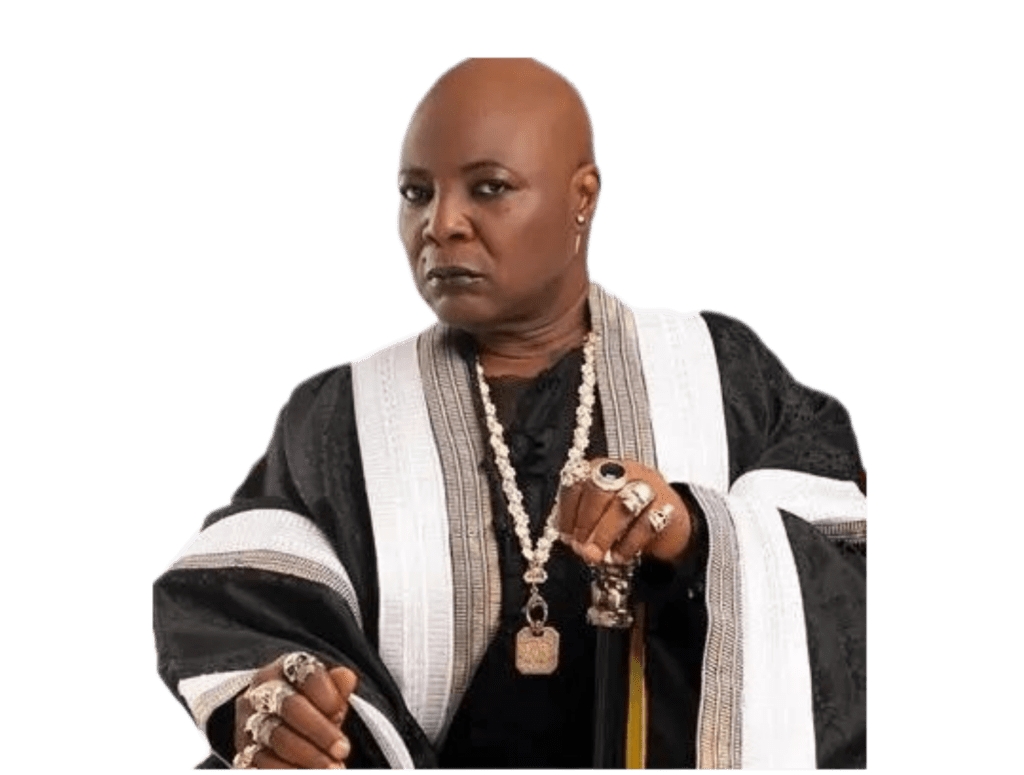 Charly Boy is dressed in a black robe with accessories
