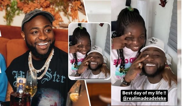 Singer Davido, dressed in a black t-shirt with "V Star" lettering and adorned with multiple gold chains, sits at a table with a glass of wine and a bottle nearby. In a heartwarming moment, he interacts with his daughter, Imade, who wears a white t-shirt with pink text. A text overlay expresses his joy, stating, "Best day of my life!! @realimadeadeleke."