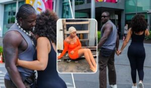 A collage featuring activist VeryDarkMan embracing his girlfriend in a close hug, walking hand-in-hand with her, and Jojo of Lele sitting on a ledge in an orange dress, set against a modern building backdrop with colorful flags.