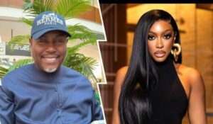 Businessman Simon Guobadia wears a blue Hermes Paris cap and shirt, smiling outdoors with lush greenery, while ex-wife Porsha Williams poses in a sleek black outfit with long straight hair and gold hoop earrings against a warm indoor backdrop.