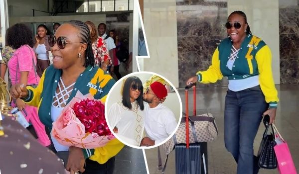 Blessing CEO is seen arriving in Asaba prior to her wedding, wearing a stylish green and yellow jacket with "MEET" on it, holding a bouquet of red roses, and smiling with sunglasses. She is surrounded by people, some offering gifts, while pulling luggage. A smaller inset photo shows her with a her man in a red hat, sharing a tender moment.