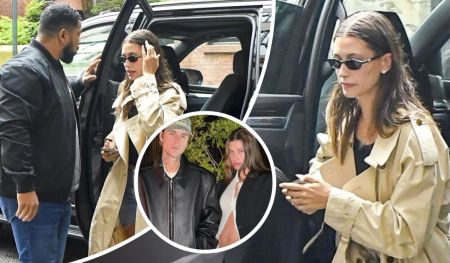 Justin Bieber and Hailey Bieber step out in coordinated style—Hailey in a beige trench coat clutching her phone, and Justin in a sleek black leather jacket, as they casually move through their day.