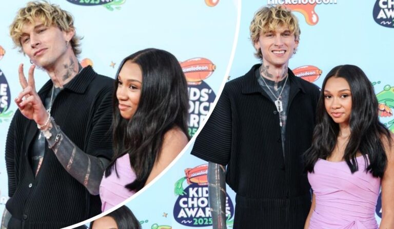 Machine Gun Kelly poses with his daughter Casie at the 2025 Nickelodeon Kids' Choice Awards, dressed in a black outfit with visible tattoos, while Casie wears a light purple dress; both stand in front of a branded event backdrop, with Kelly flashing a peace sign.