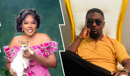 Toyin Abraham, dressed in a pink embellished gown and holding a white-and-orange cat, poses beside her ex-husband Adeniyi Johnson, who is seated in a white-and-gold chair wearing a mustard yellow shirt. Their contrasting appearances and composed expressions subtly reflect distinct personal styles and separate narratives.