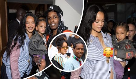 Rihanna, dressed in a blue and white striped shirt with gold accessories, stands beside ASAP Rocky, who sports a black and orange outfit with a Yankees cap. Their son Riot wears a denim jacket with patches as the family appears at a public event, surrounded by onlookers.
