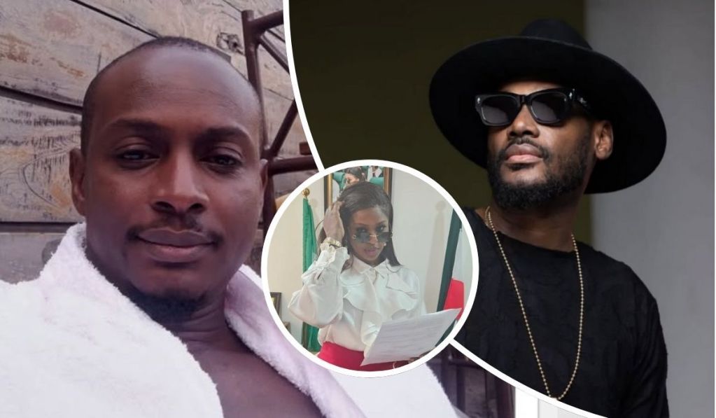 Charles stands in a white robe against a wooden backdrop, Natasha appears in a white blouse and red skirt holding a paper in front of a flag, and 2Baba is dressed in black with a hat and necklace.