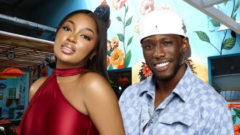 BBNaija Season 10 housemates Mide and Kayikunmi posing together inside the Big Brother Naija house, with a vibrant floral mural and lounge setting in the background.