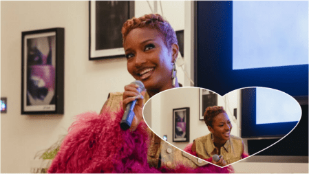 Ayra Starr smiles while holding a microphone during a lively conversation, dressed in a gold vest and pink feathered sleeves, with a heart-shaped inset showing her laughing mid-speech in the same setting.