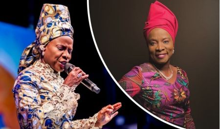 Grammy-winning singer Angelique Kidjo appears in two vibrant ensembles: one featuring a blue, gold, and white patterned outfit with a matching headwrap while holding a microphone, and another in a colorful floral outfit with a bright pink headwrap and statement necklace, exuding elegance and cultural pride.