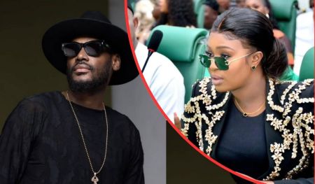 Singer 2baba, dressed in a black outfit with a gold chain and hat, poses beside Natasha Osawuru, who wears a black top with gold embroidery and matching earrings in a formal setting.