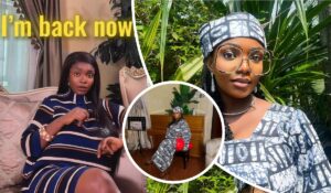 BBNaija star Peace Ogor appears in a vibrant collage of three scenes. In the central frame, she lounges on a plush couch in a stylish room, wearing a striped blue, white, and brown dress with the phrase “I'm back now” boldly displayed above. The top right captures her outdoors in a traditional outfit and headwrap, surrounded by lush greenery. The bottom center shows her seated indoors beside a piano, holding a red handbag, with elegant decor including a framed picture and potted plant.