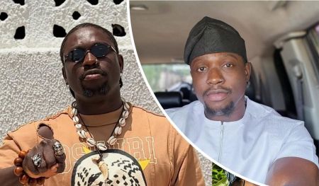 Activist VeryDarkMan appears in two contrasting settings: on the left, wearing a brown shirt labeled "OSUNRI" with bold accessories including a beaded necklace, rings, and a wooden bracelet against a textured white wall; on the right, dressed in a white traditional outfit and black cap, seated inside a vehicle with a view through the window.