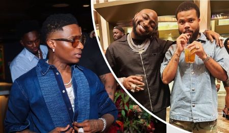 Wizkid appears in a casual denim ensemble paired with accessories that highlight his signature style, while Davido and Asa Asika share a moment of relaxed camaraderie—Davido sporting layered jewelry and Asa holding a drink in hand. The scene captures a fashionable glimpse into Nigeria’s music elite.