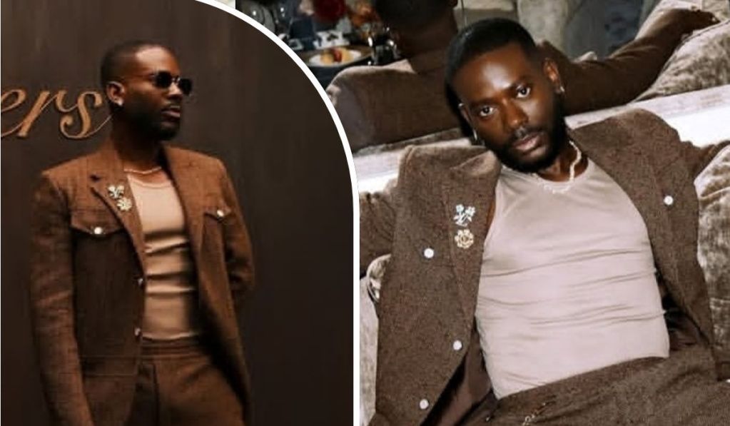 A collage showcases Nigerian musician Adekunle Gold in two stylish poses, wearing a brown suit with a floral pin and a light shirt, first standing against a wooden backdrop and then lounging on a plush couch.