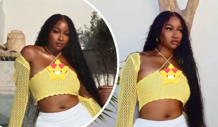 BBNaija star Kim Oprah is showcased in a vibrant yellow crocheted crop top with long sleeves, paired with white bottoms, standing against a backdrop of greenery and a wooden pole, with a smiling star emoji overlay on her chest.