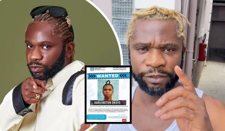 A collage featuring rapper Speed Darlington, with one side showing him in a stylish outfit with sunglasses resting on his head, pointing forward. The other side displays him with blonde dreadlocks, pointing at a "WANTED" poster for Darlington Okoye, issued by the National Agency for the Prohibition of Trafficking in Persons, including his aliases and contact information.