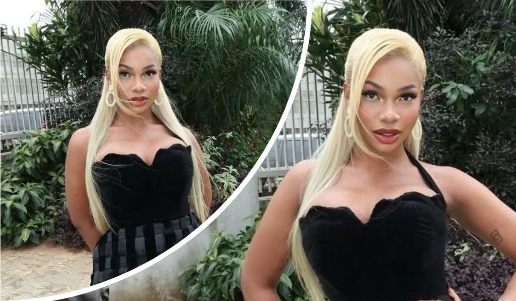 Tacha poses outdoors in a fitted black top and long blonde hair, showcasing her bold fashion style amid greenery.