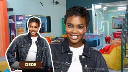 BBNaija Season 10 housemate Dede smiling in a denim jacket inside the Big Brother Naija house lounge, with an inset showing her official introduction photo.