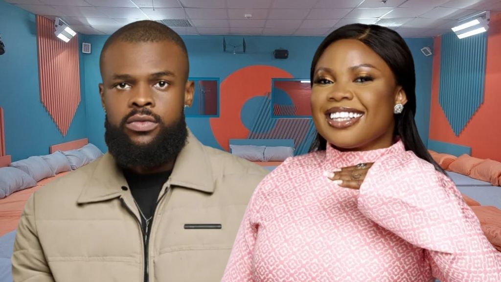 Big Brother Naija Season 10 housemates Denari and Doris pose inside the house. Denari stands in a beige jacket with a serious look, while Doris beams in a pink patterned outfit.