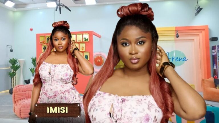 BBNaija Season 10 housemate Imisi poses elegantly in a floral dress, standing confidently inside the Big Brother house arena.