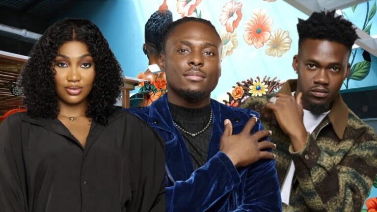 BBNaija Season 10 housemates Sultana, Faith, and Jason pose confidently against a floral mural background inside the Big Brother house.