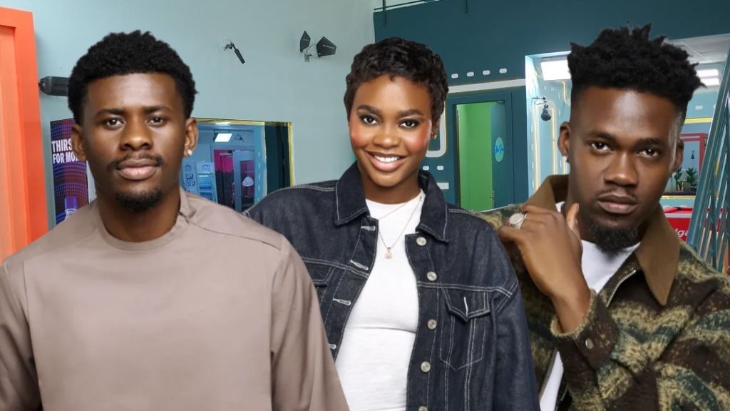 Big Brother Naija housemates Victory, Dede, and Jason Jae posing together indoors, each dressed in stylish casual outfits and smiling for the camera.
