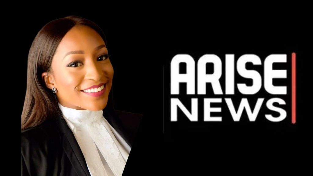 Arise TV anchor Somtochukwu Christelle Maduagwu smiles in a professional portrait, wearing a white blouse with a black blazer, beside the Arise News logo on a black background.