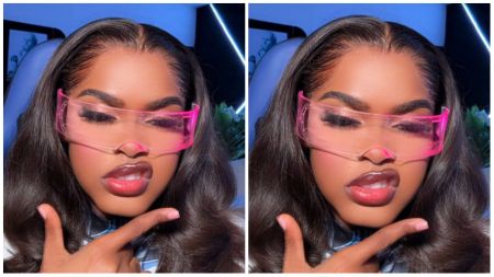 Javis poses stylishly in a close-up selfie, wearing futuristic pink-tinted visor glasses and giving a playful expression with glossy lips while pointing a finger toward her chin.