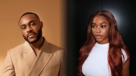 BBNaija Season 10 housemates Kola and Dede pictured side by side. Kola, dressed in a beige pinstriped suit jacket, poses against a warm tan background. Dede, wearing a fitted white top with her long auburn hair styled in waves, stands against a dark backdrop, looking poised and elegant.