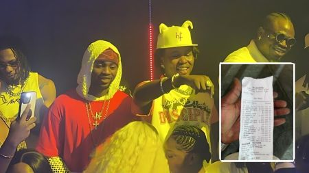 Singer Omah Lay with close friends at a Lagos nightclub, smiling and posing for photos while surrounded by fans, with an inset showing a club receipt of luxury drinks.