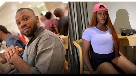 Nigerian man Lintex Ogale pictured sitting indoors, alongside his Benue State girlfriend dressed casually in a white top, black shorts, and a pink cap.