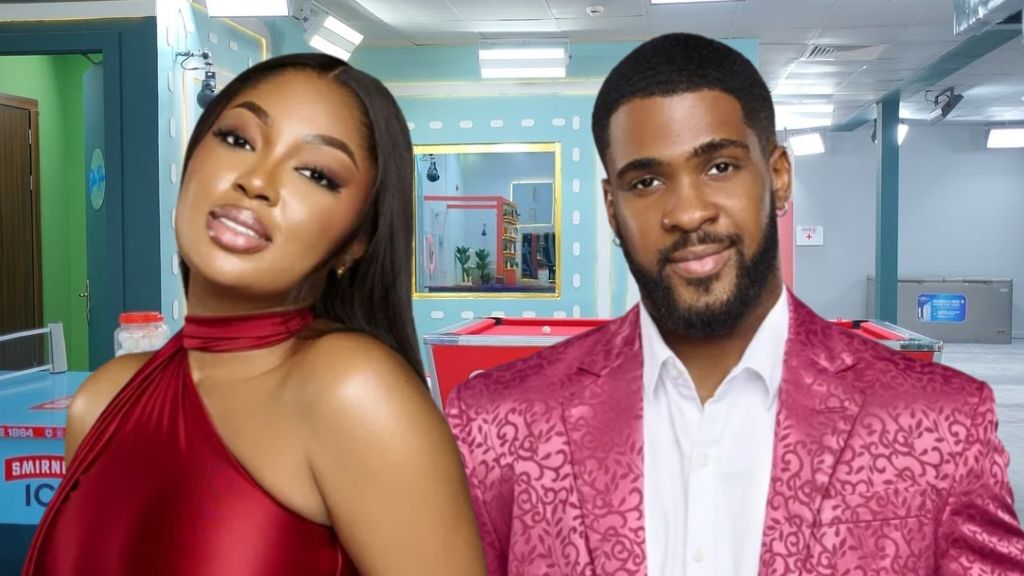 BBNaija Season 10 housemates Mide and Bright pose together in the house. Mide wears a bold red halter-neck dress with soft glam makeup, while Bright stands beside her in a patterned pink suit jacket over a white shirt, both smiling confidently at the camera.
