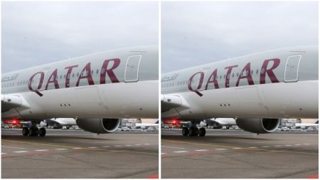 Qatar Airways plane parked on the tarmac, showing the airline’s name boldly displayed on the aircraft body.