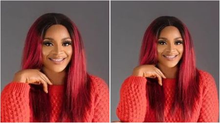 Nollywood actress Uche Ogbodo smiling in a red knit sweater with straight red and black hair, posing with her hand resting under her chin.